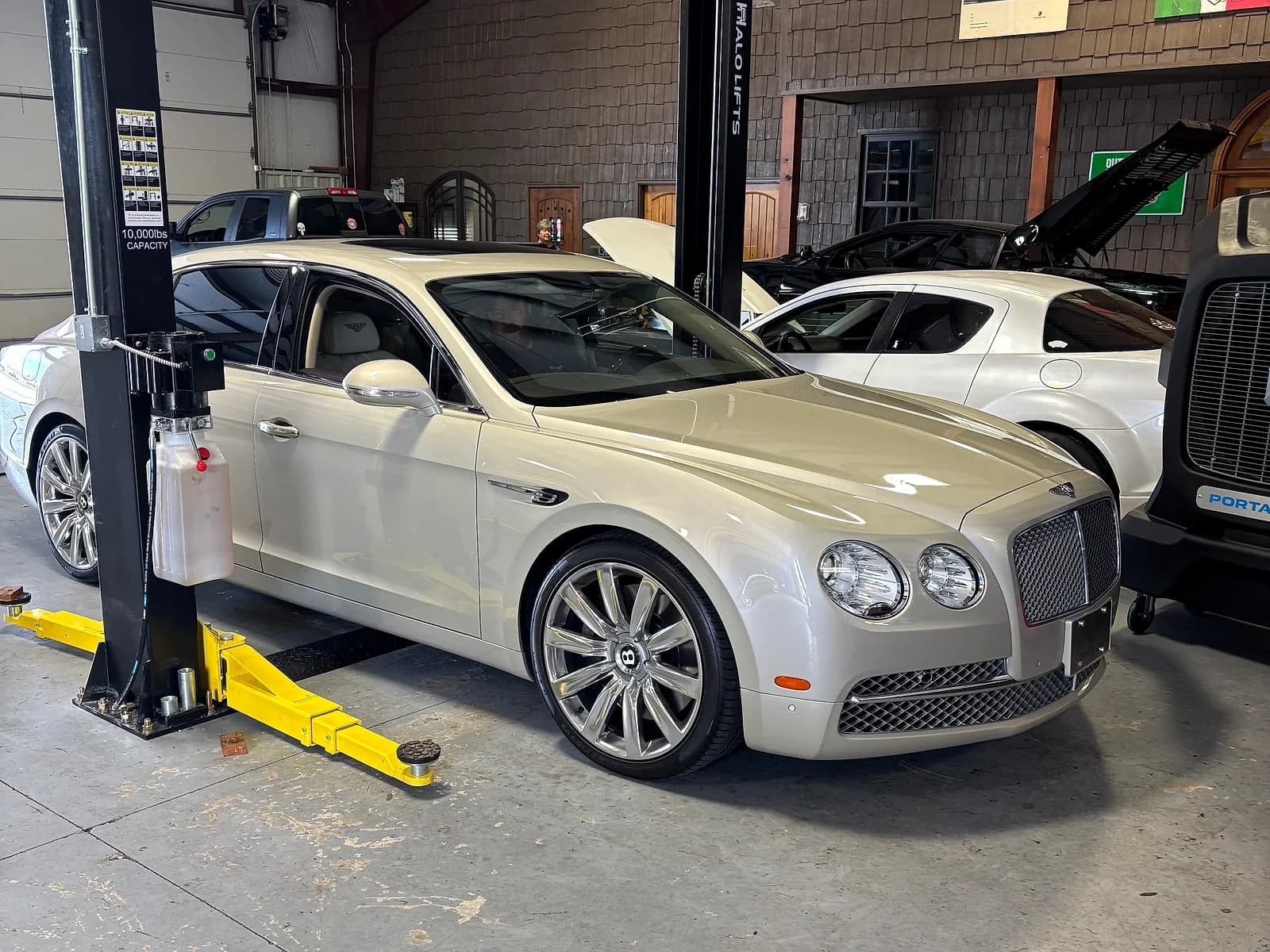 Bentley engine bay opened for scheduled maintenance